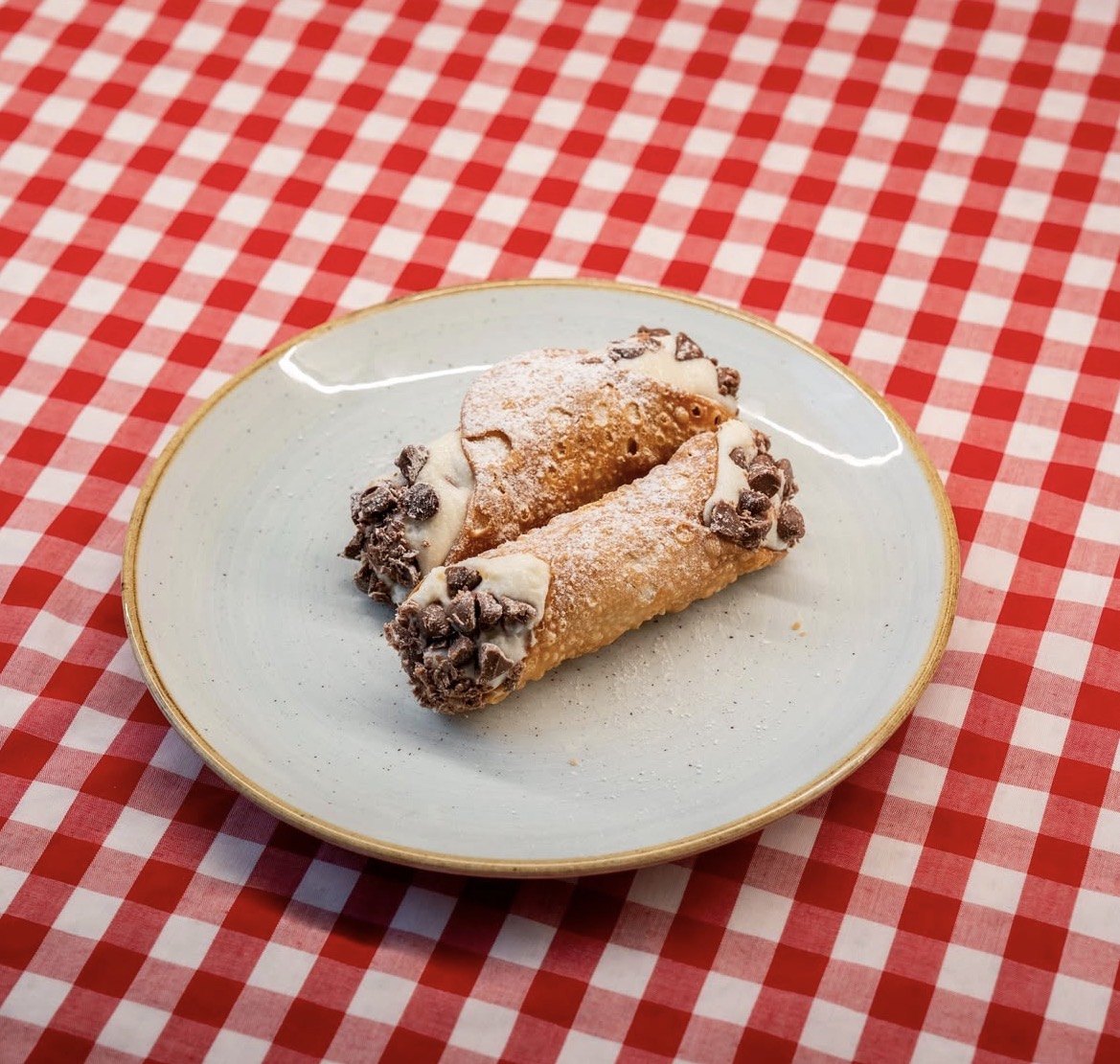 Sicilian cannoli dusted with icing sugar