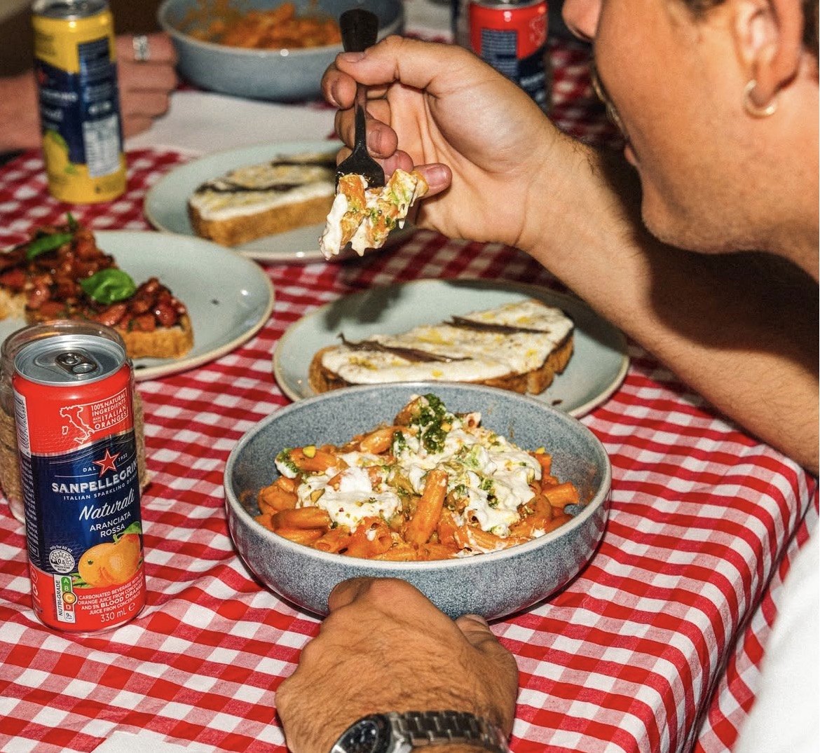 Guest eating a bowl of pasta