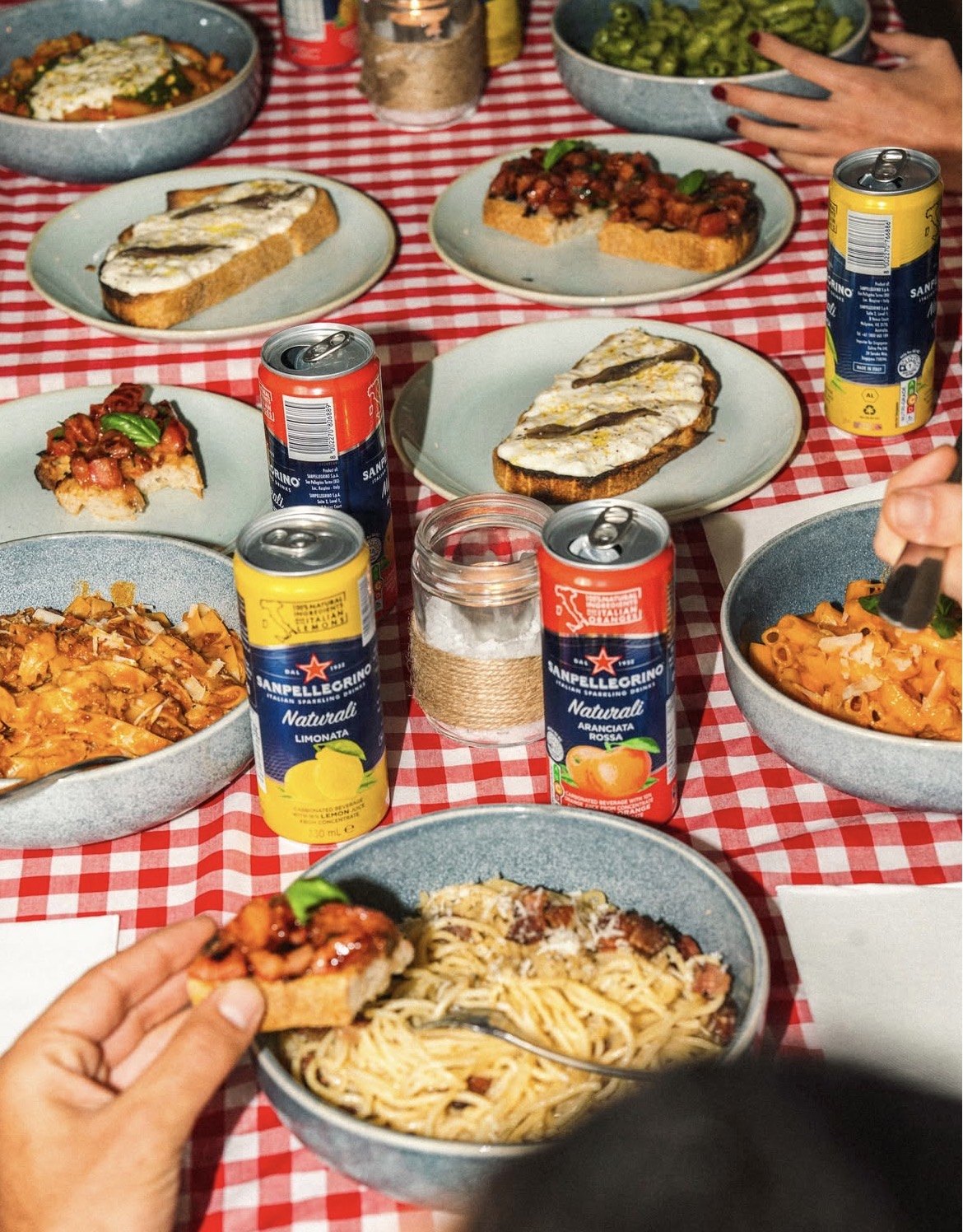 A table full of fresh pasta dishes, bruschetta and cannoli